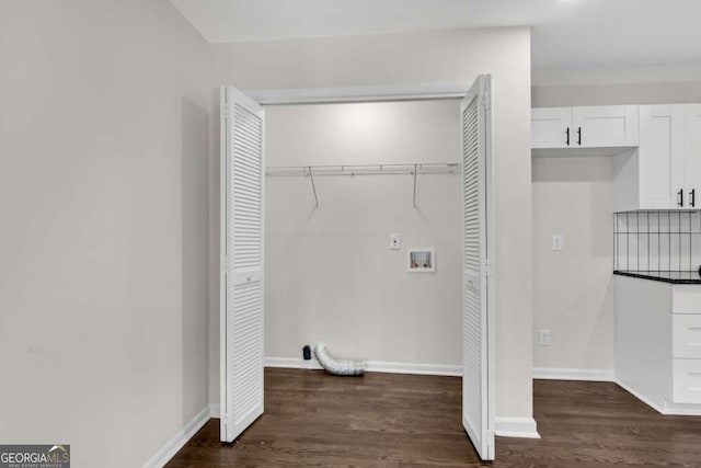 laundry room featuring washer hookup and dark wood-type flooring