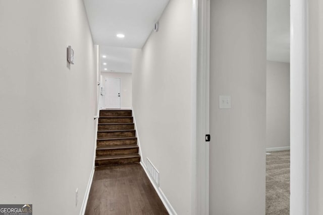 hall with dark wood-type flooring