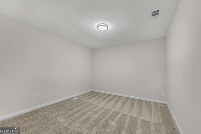 empty room featuring carpet flooring