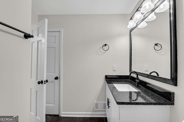 bathroom with tile patterned floors and vanity