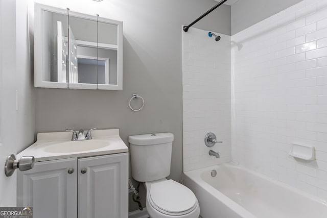 full bathroom featuring toilet, vanity, and tiled shower / bath combo