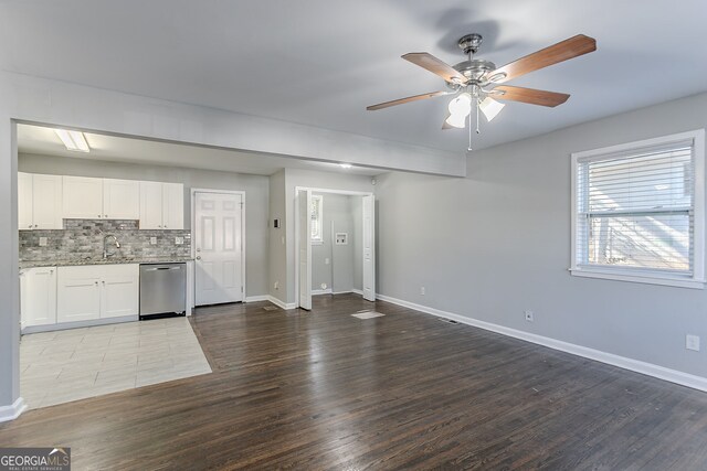 unfurnished living room featuring sink, ceiling fan, and light hardwood / wood-style flooring