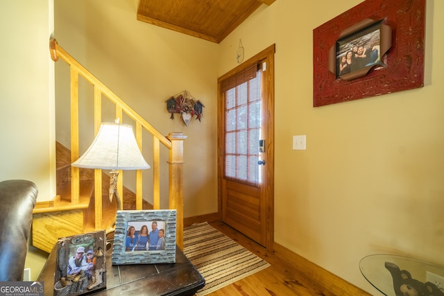 doorway to outside featuring hardwood / wood-style floors and wooden ceiling