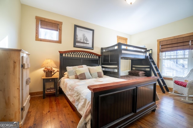 bedroom with hardwood / wood-style floors