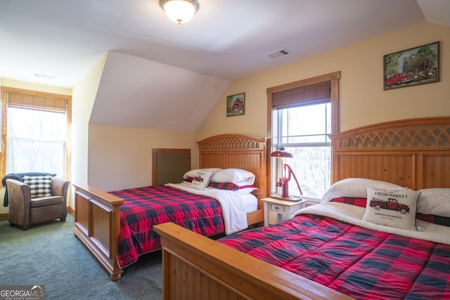 bedroom featuring carpet floors and vaulted ceiling