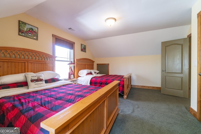 carpeted bedroom featuring vaulted ceiling