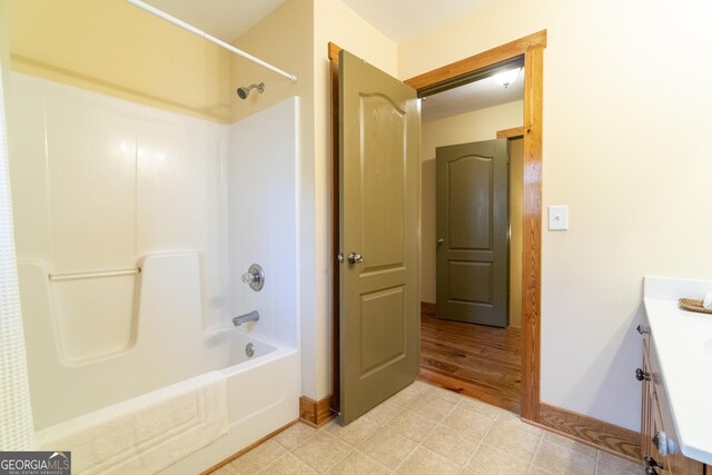 bathroom featuring shower / tub combination and vanity