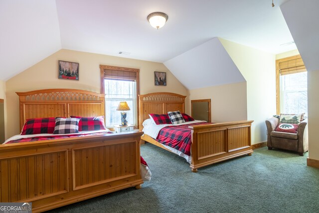 carpeted bedroom with vaulted ceiling