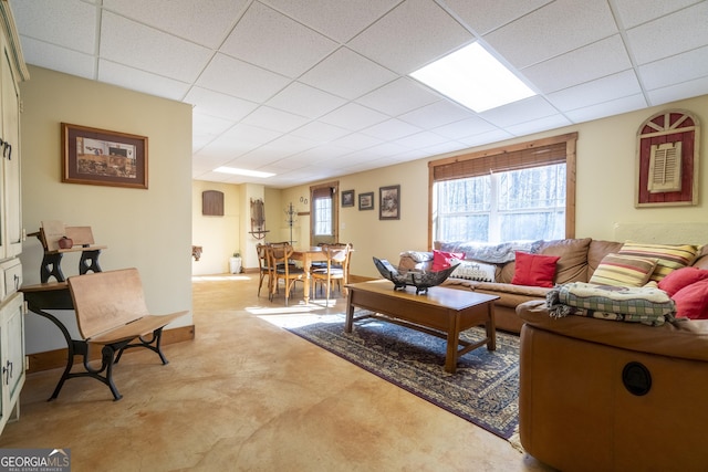 living room with a paneled ceiling