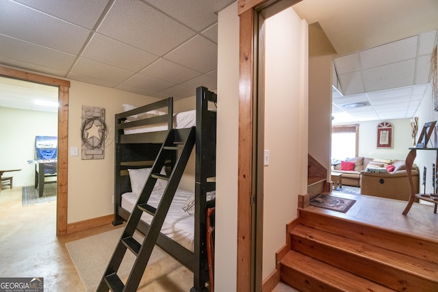 bedroom featuring a drop ceiling