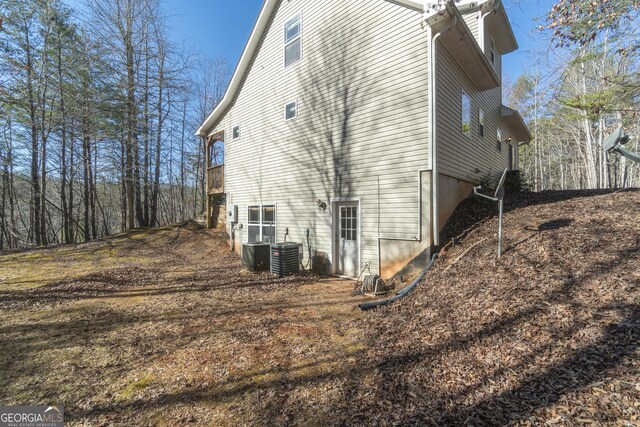 view of home's exterior with cooling unit