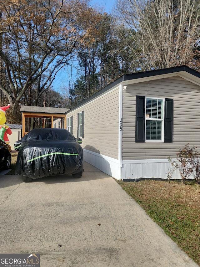 view of home's exterior featuring a carport