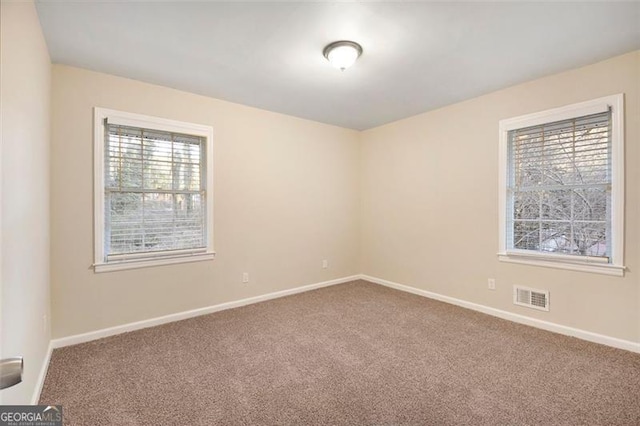 spare room featuring carpet flooring