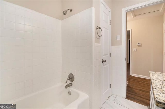 bathroom with shower / bathing tub combination and vanity