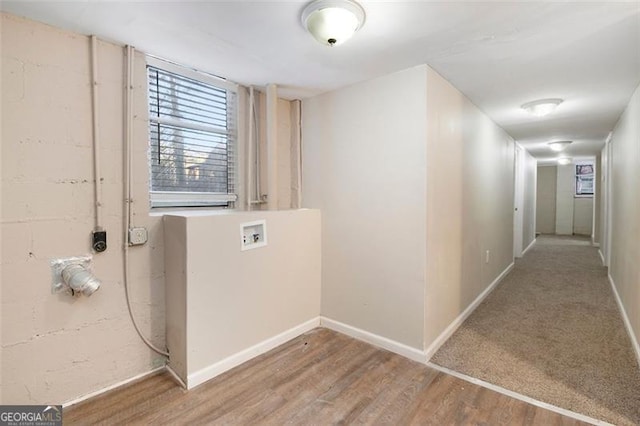 corridor featuring wood-type flooring