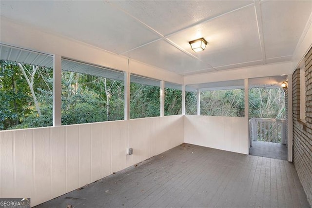 unfurnished sunroom with a healthy amount of sunlight