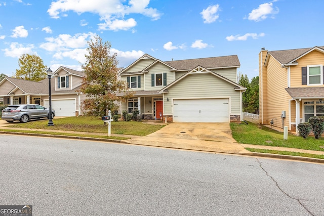 view of front of home with a front yard and a garage