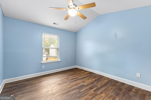 spare room with ceiling fan, dark hardwood / wood-style flooring, and lofted ceiling