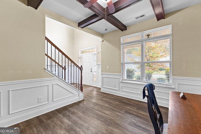 unfurnished office with beamed ceiling, dark hardwood / wood-style flooring, ceiling fan, and coffered ceiling