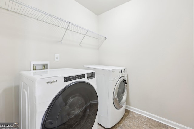 clothes washing area featuring washing machine and dryer