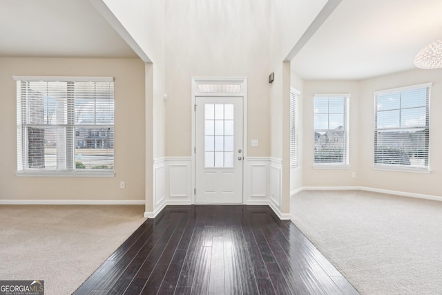 entrance foyer featuring dark hardwood / wood-style flooring