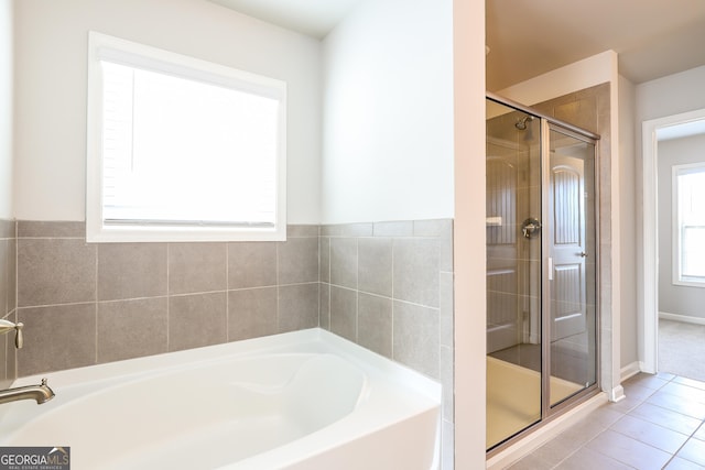 bathroom featuring separate shower and tub and tile patterned floors