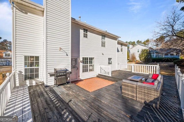 deck featuring a grill and an outdoor hangout area