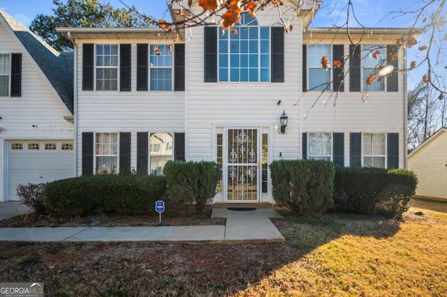 view of front of property with a garage