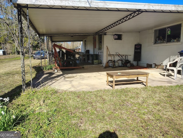 rear view of property featuring a patio area and a yard