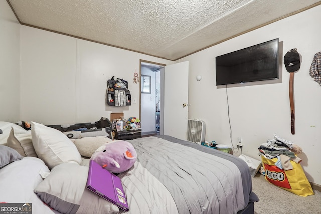 bedroom featuring vaulted ceiling, carpet, a textured ceiling, and ornamental molding