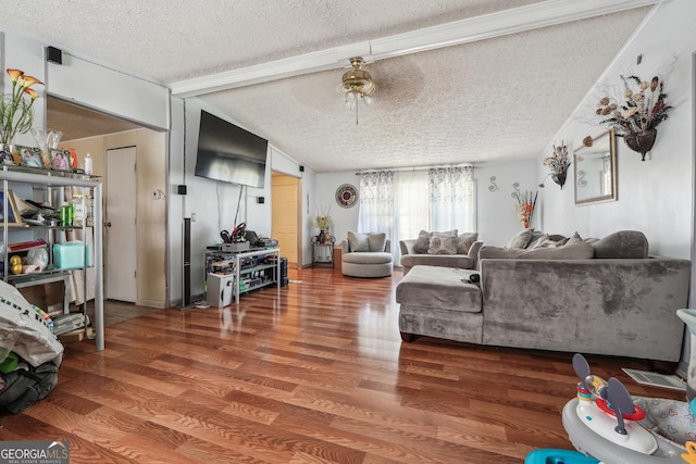 living room featuring a textured ceiling, vaulted ceiling, ceiling fan, crown molding, and hardwood / wood-style flooring