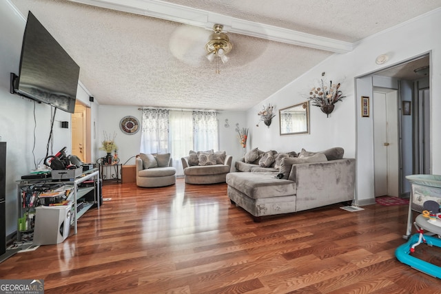 living room featuring ceiling fan, dark wood-type flooring, lofted ceiling with beams, and a textured ceiling