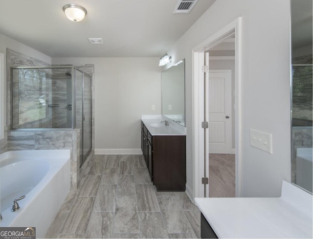 bathroom featuring vanity and plus walk in shower