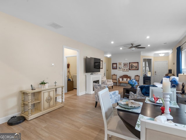 dining space featuring ceiling fan and light hardwood / wood-style flooring