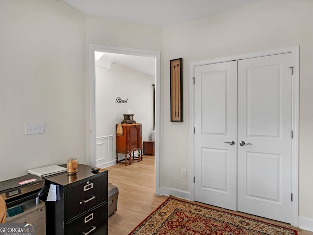 hall with light hardwood / wood-style floors
