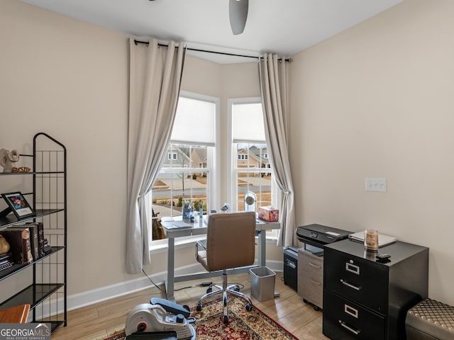 office with light hardwood / wood-style floors