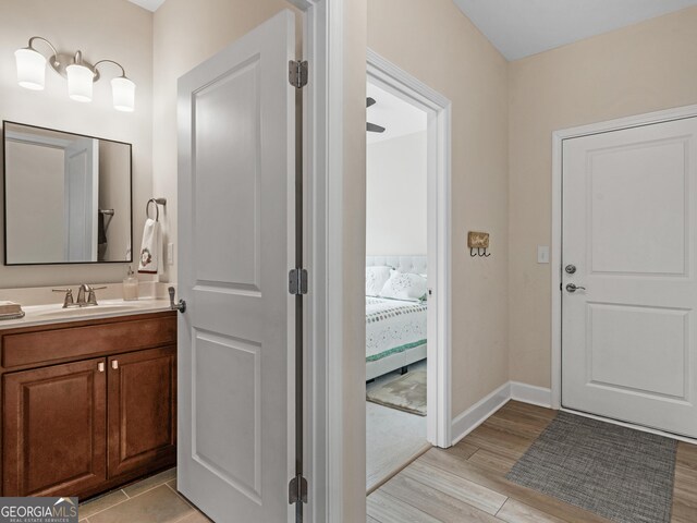 bathroom featuring vanity and wood-type flooring