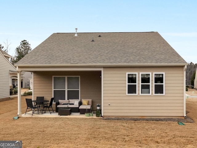 rear view of house featuring an outdoor living space, a patio area, and a yard