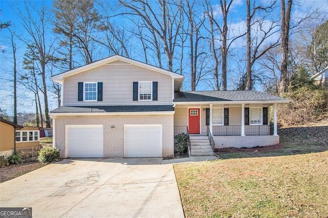 2343 Maryland Ct, Decatur, GA 30032 - split level home with a porch, a garage, and a front yard
