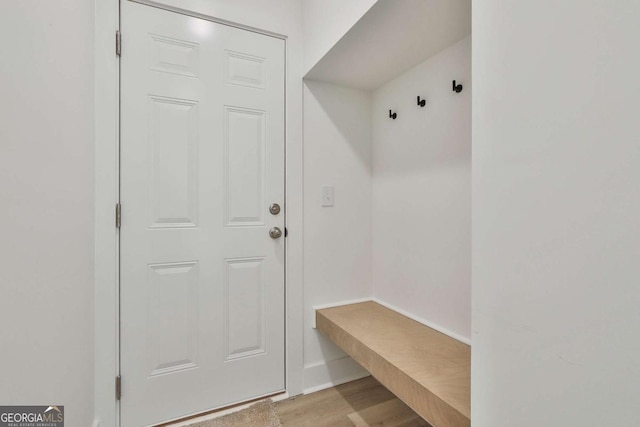 mudroom with light hardwood / wood-style floors