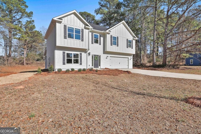 view of front of home featuring a garage, board and batten siding, and concrete driveway