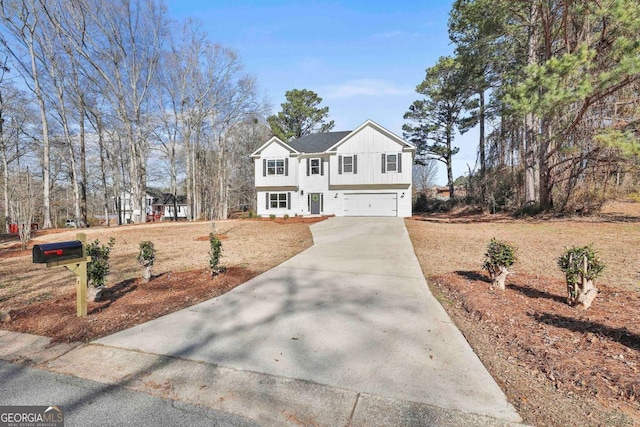 view of front facade featuring a garage, driveway, and board and batten siding