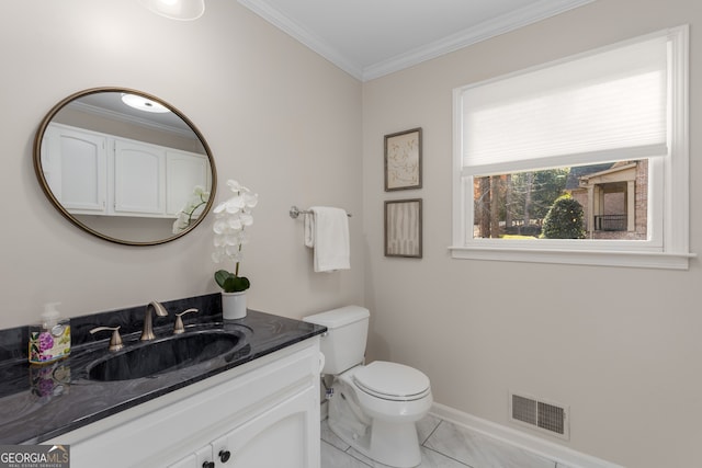 bathroom featuring tile patterned floors, vanity, toilet, and crown molding