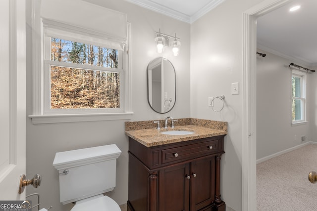 bathroom featuring vanity, toilet, and ornamental molding