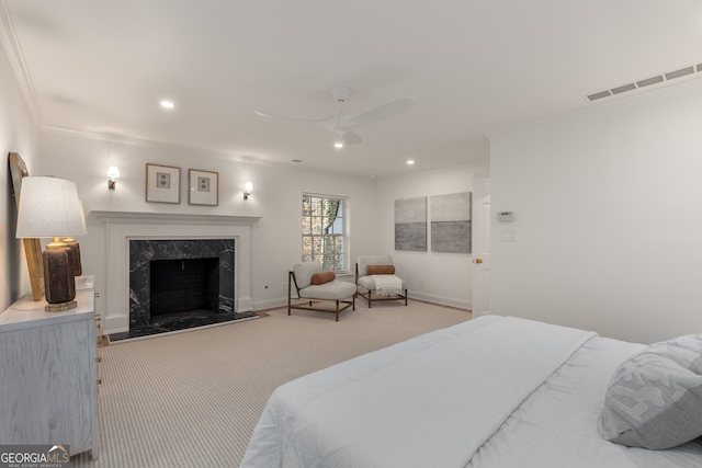 bedroom with carpet, ceiling fan, crown molding, and a high end fireplace