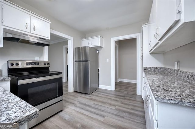 kitchen with white cabinets, light hardwood / wood-style floors, light stone countertops, and appliances with stainless steel finishes