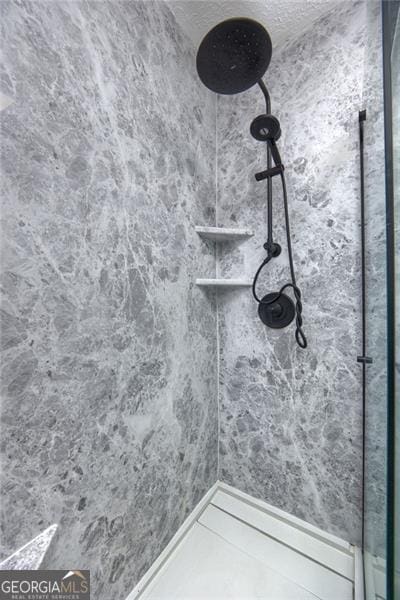 interior space featuring tiled shower