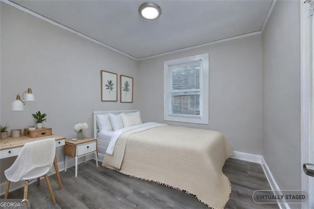 bedroom featuring dark hardwood / wood-style floors and crown molding