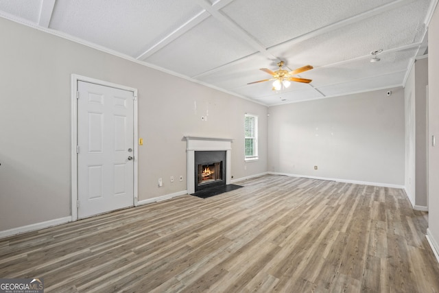 unfurnished living room featuring hardwood / wood-style floors, ceiling fan, a textured ceiling, and coffered ceiling