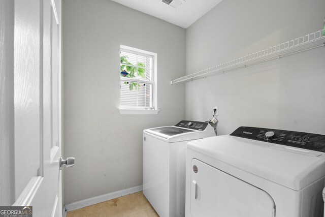 laundry room with separate washer and dryer